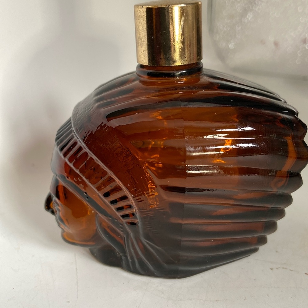 Avon brown glass Indian head like the hood ornament